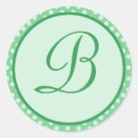 Autocollant vert d'initiale de monogramme de point