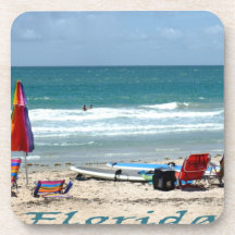 beach chairs surfboards umbrellas sand ocean beverage coaster