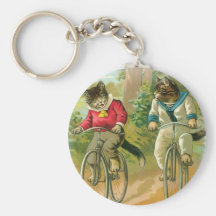 Chats montant des vélos porte-clefs