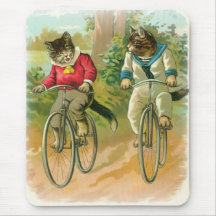 Chats montant des vélos tapis de souris