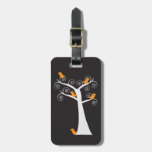Cinq oiseaux oranges dans une étiquette de bagage 