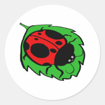 Coccinelle de sourire sur une feuille verte autocollants