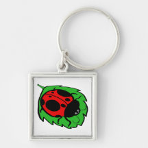 Coccinelle de sourire sur une feuille verte porte-clé