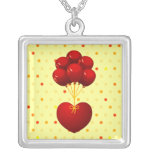 Coeur rouge avec des ballons, collier