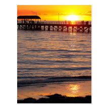 Coucher du soleil à la plage de grange et à la jet carte postale