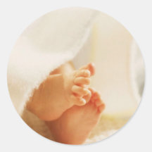 Couverture enveloppée par pieds mignons de bébé de adhésifs