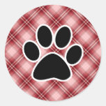 Empreinte de patte rouge de plaid autocollant rond