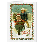 Enfants vintages de carte de Noël dans la neige