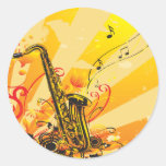 Faisceaux bariolés de saxophone de la musique adhésif rond