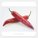 Fermez-vous des poivrons de piment rouge sur le bl adhésifs