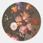 Fleurs dans un vase en verre adhésif rond