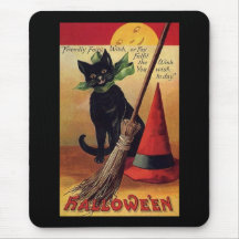 Halloween vintage avec un chat noir, un balai et u tapis de souris