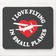 J'aime voler dans de petits avions tapis de souris