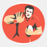joueur de rugby défendant la boule rétro autocollant