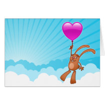 Lapin mignon avec le ballon de coeur dans la carte cartes