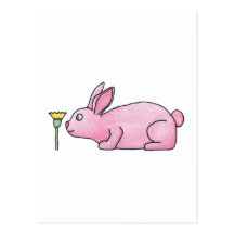 Lapin rose avec la fleur carte postale