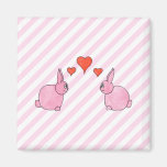 Lapins roses avec des coeurs magnets