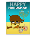 Le chiot heureux de carte de Hanoukka joue Dreidel
