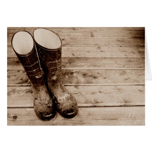 Les bottes en caoutchouc boueuses d'un agriculteur carte de vœux