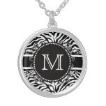 Motif de zèbre avec le cool de monogramme et audac pendentif