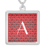 Motif rouge de crânes de monogramme bijouterie