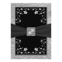 Noir et invitation décorée d'un monogramme florale