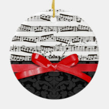 Notes de musique et ruban de rouge de faux ornement de noël