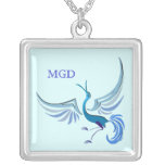 Nuances de monogramme d'oiseau en vol de bleu collier
