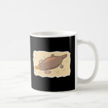 ornithorynque mignon dans le sable tasses