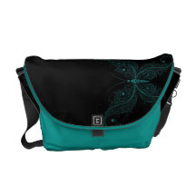 Papillon sensible de turquoise sur le noir sacoche