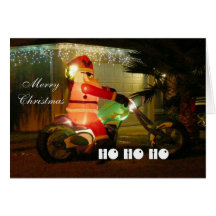 Père Noël sur une moto venant à la ville Carte De Vœux