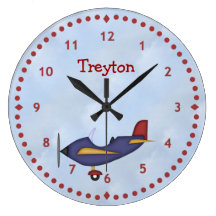 Peu d'horloge murale bleue d'avion