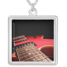 Photo rouge de guitare électrique - PERSONNALISEZ Bijouterie Personnalisée