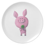 Porc chanceux avec le trèfle chanceux de quatre fe assiettes