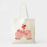 Porcs mignons de bande dessinée dans le sac d'amou