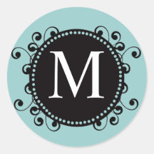 Remous du monogramme M de noir bleu épousant l'aut