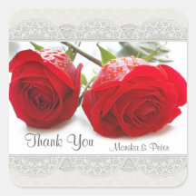 Roses rouges épousant l'autocollant de Merci