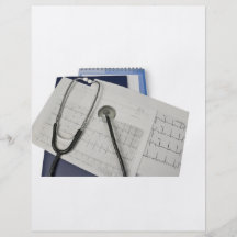 stéthoscope médical sur des lectures du cardiogram prospectus en couleur