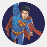 Superman volant en avant autocollant rond