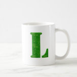 Tasses de monogramme de pochoir d'herbe