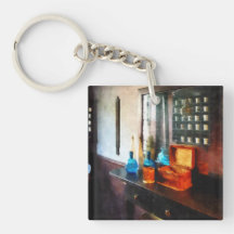 Tonique de cheveux et tasses de rasage porte-clé