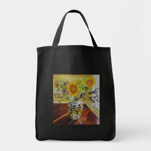 Tournesols dans le sac d'épicerie italien de vase