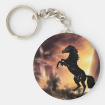 Un étalon de élevage au coucher du soleil porte-clefs