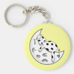 Vache mignonne à bande dessinée dormant sur la lun porte-clef