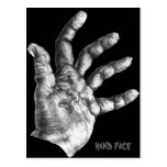 visage de main cartes postales