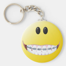 Visage de smiley de croisillons porte-clefs
