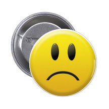 Visage souriant triste pin's avec agrafe