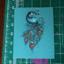 Recherche de plumes cartes postales Paon