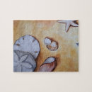 Recherche de coquillages puzzles Sable