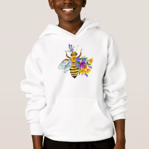 Abeille à fleurs avec plantes sauvages